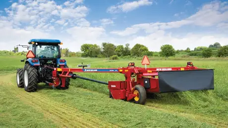 Tractor pulls Discbine Side-Pull Disc-Mower Conditioner