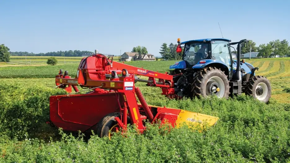 Tractor pulls Discbine Plus Center-Pivot disc mower conditioner