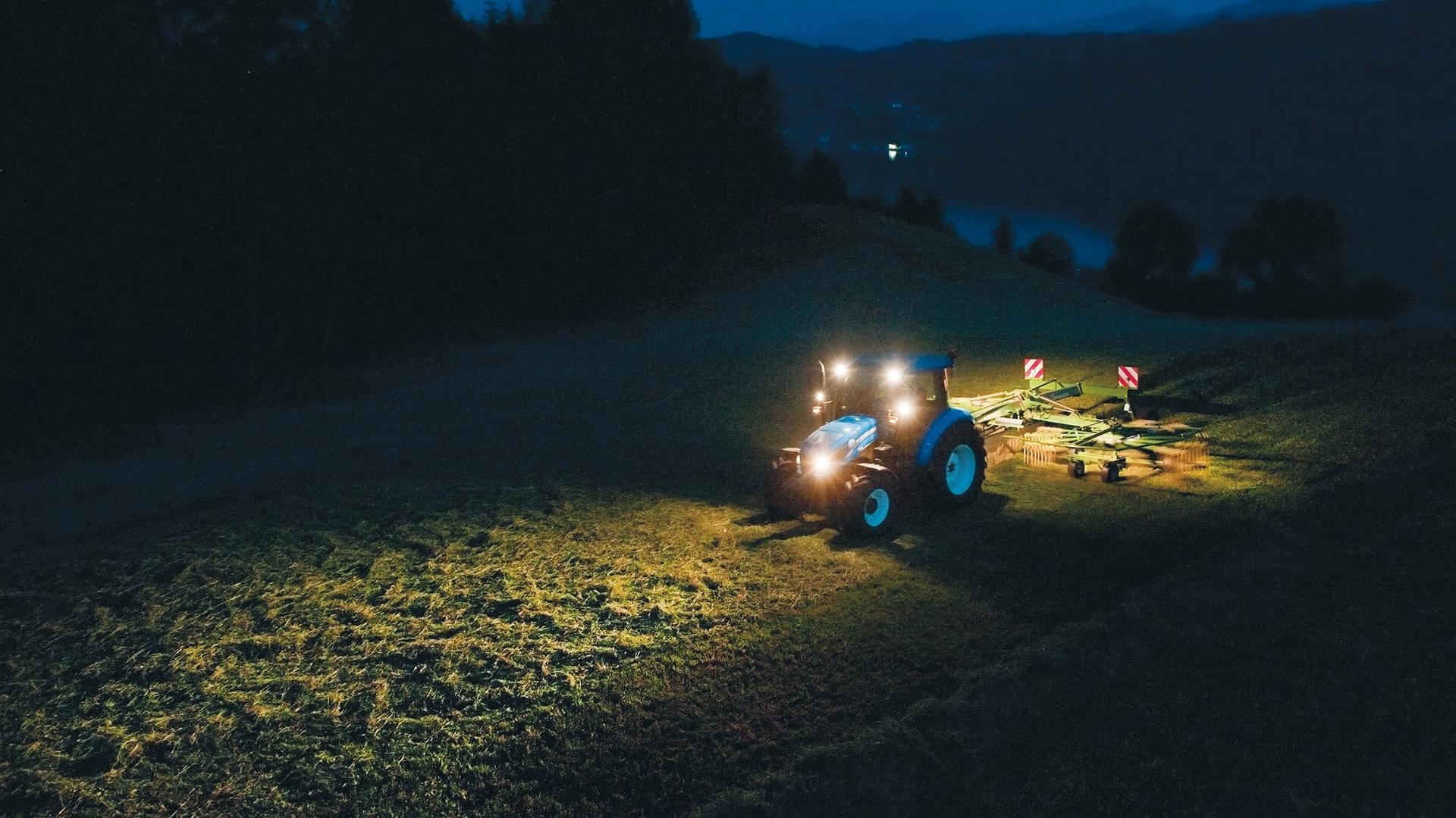 New Holland T4 agricultural tractor actively working on the field