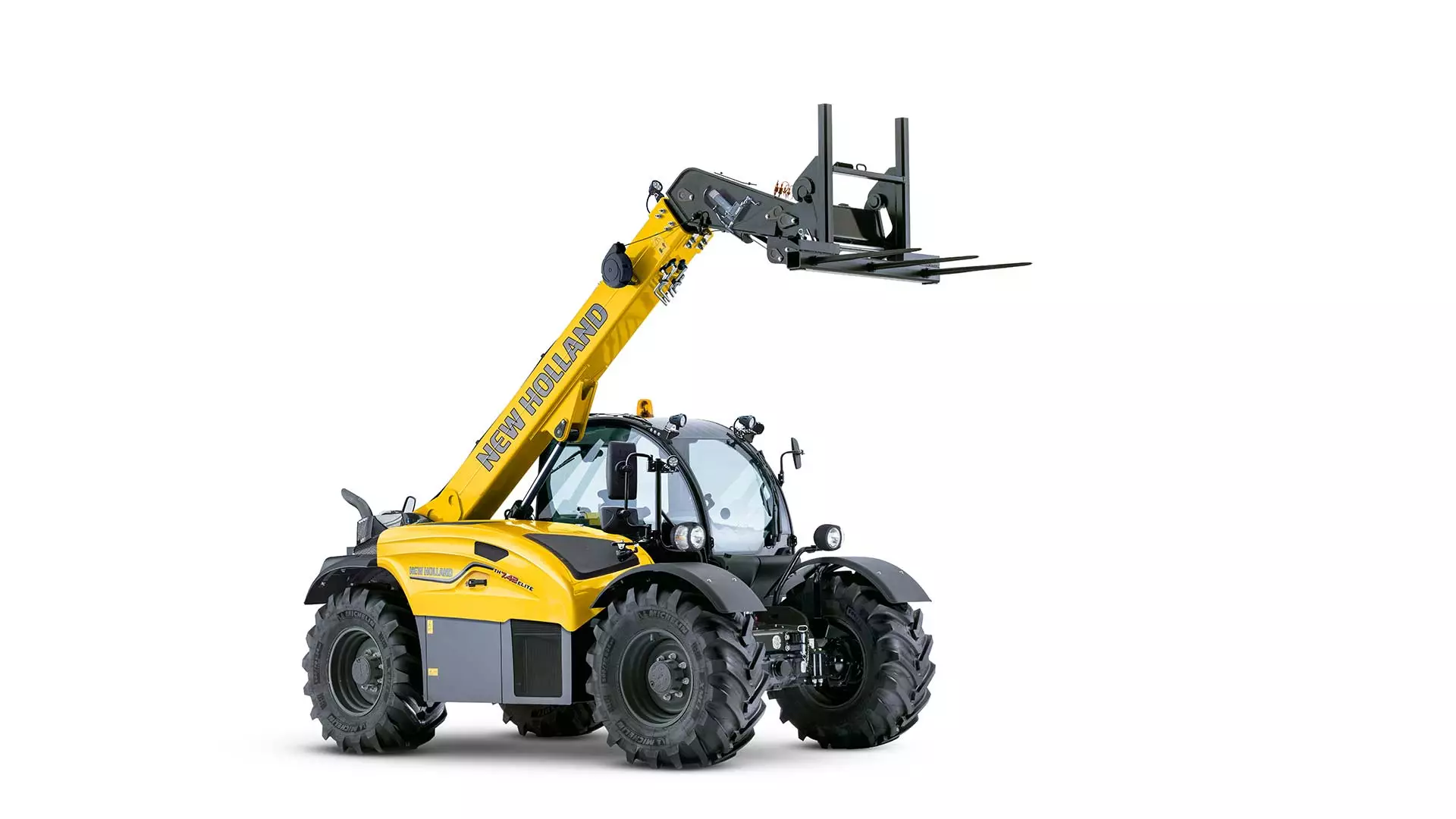 New Holland compact telehandler TH series with extended forklift arms.