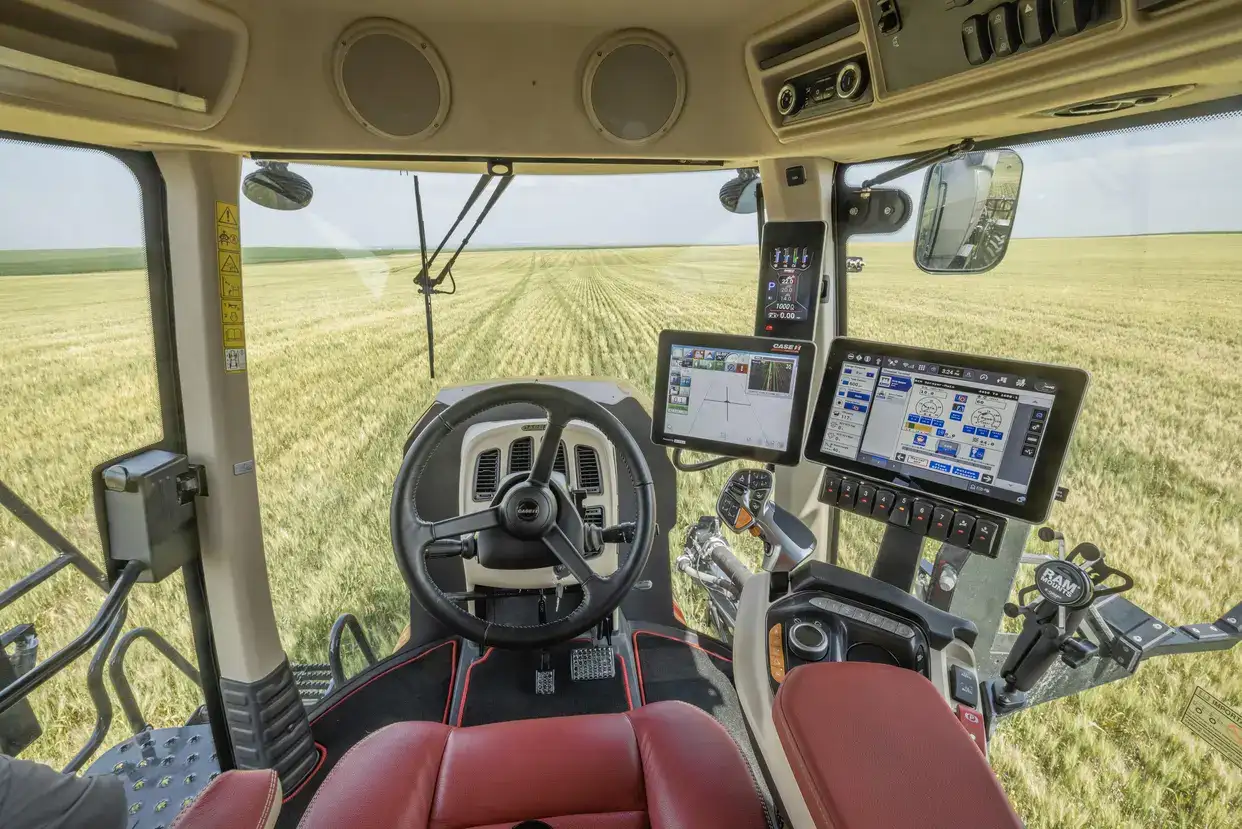 Inside a cab of a Case IH Patriot 4450 sprayer with Viper 4+ displays mounted.