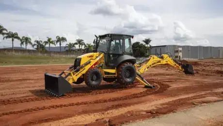 outdoor photo of a New Holland Construction backhoe loader in operation.
