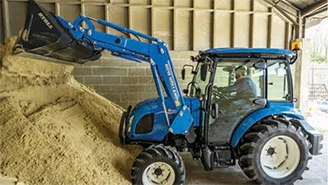 New Holland tractor with a Front Loader 340TL working.