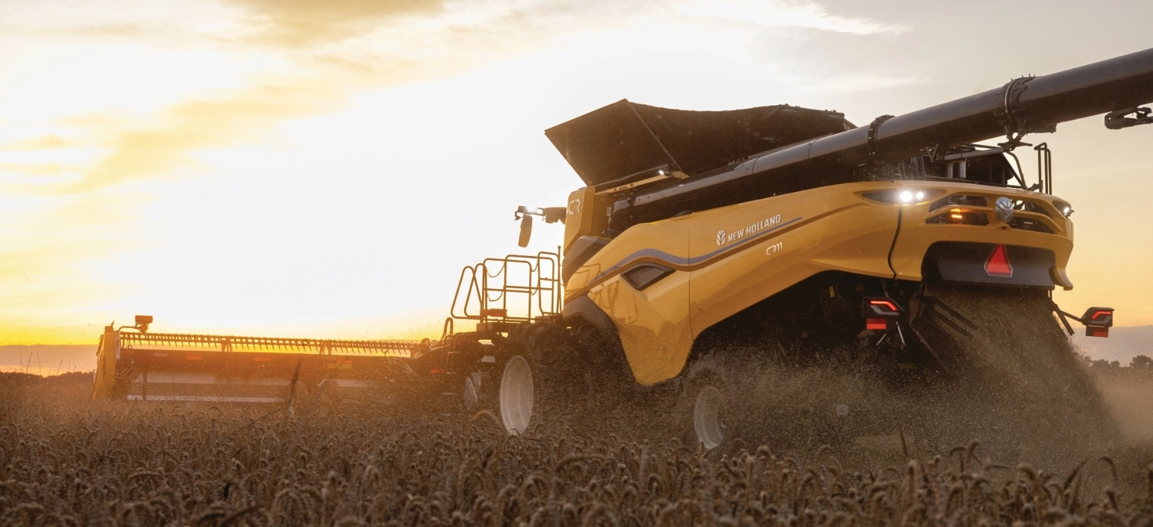 New Holland CR Series combine in the field from behind