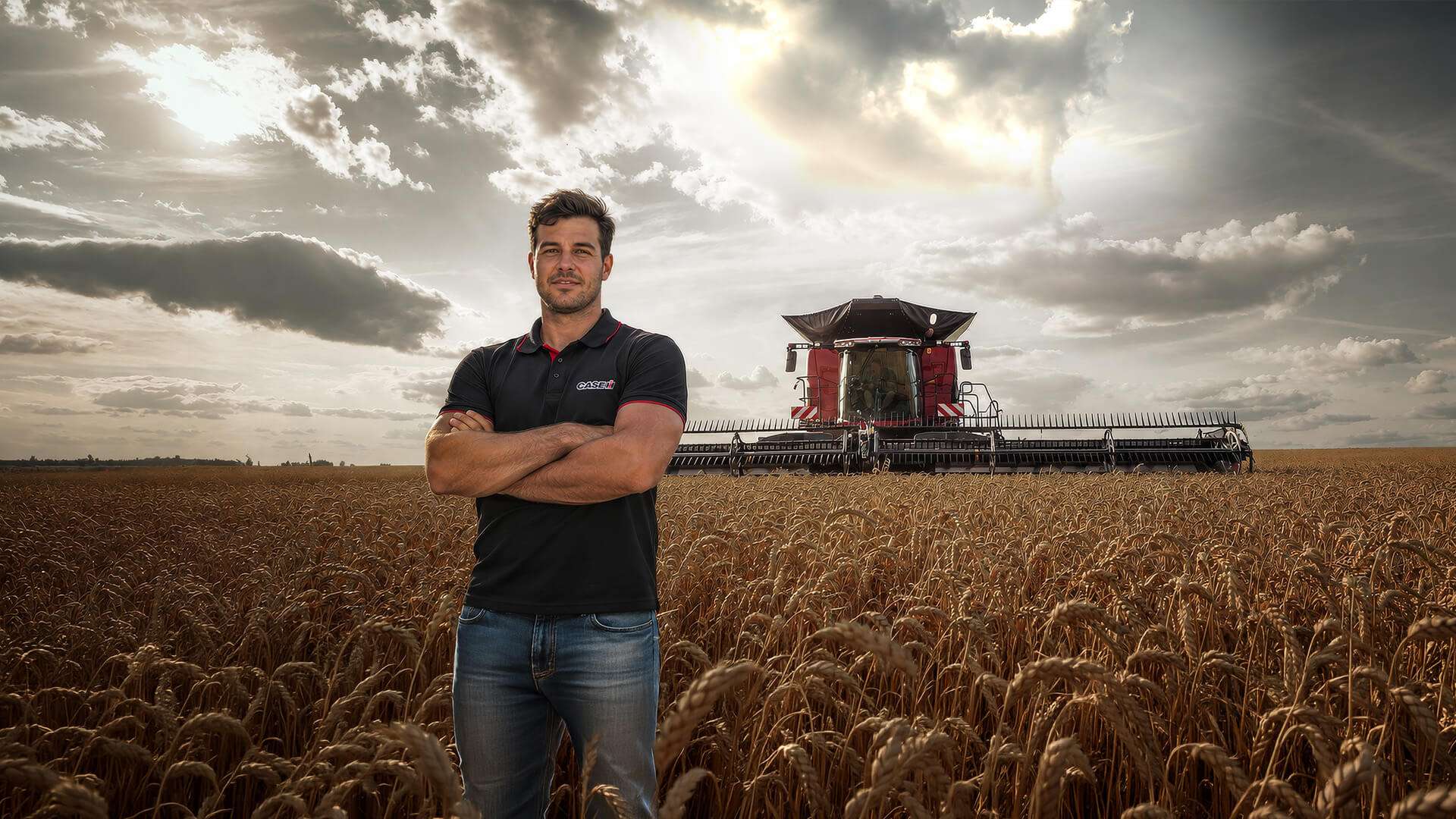 Case IH farmer standing in front of Case IH Axial-Flow combine harvester