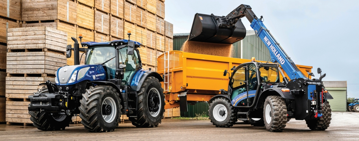 Blue Power edition T7 tractor next to a telehandler