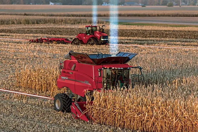 Axial-Flow 9250 and Steiger 540 with light beams in field