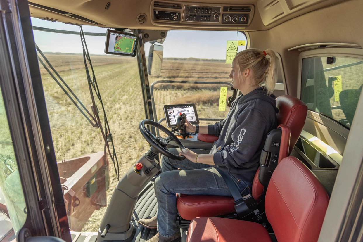 Producer in cab of Axial-flow 9260 combine