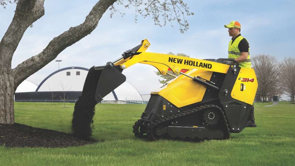 C314 Mini Track Loader with a bucket attachment