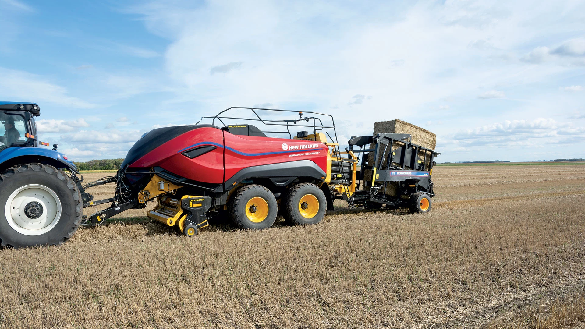 BigBaler High Density Large Square Baler behind a tractor in the field