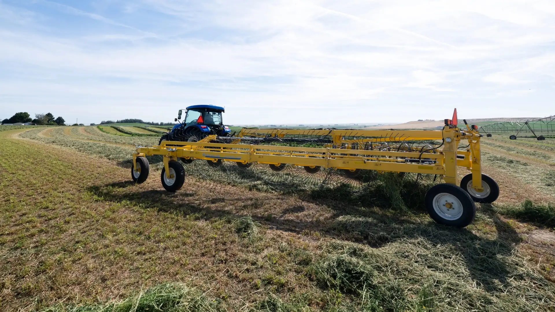 Yellow Trailing wheels in a field.