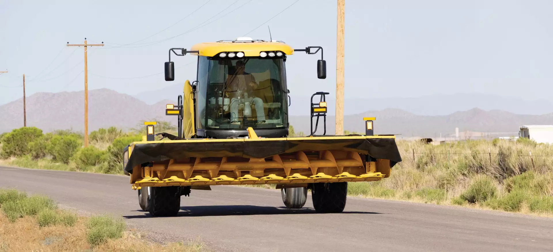 Speedrower® PLUS Self-Propelled Windrower on the road