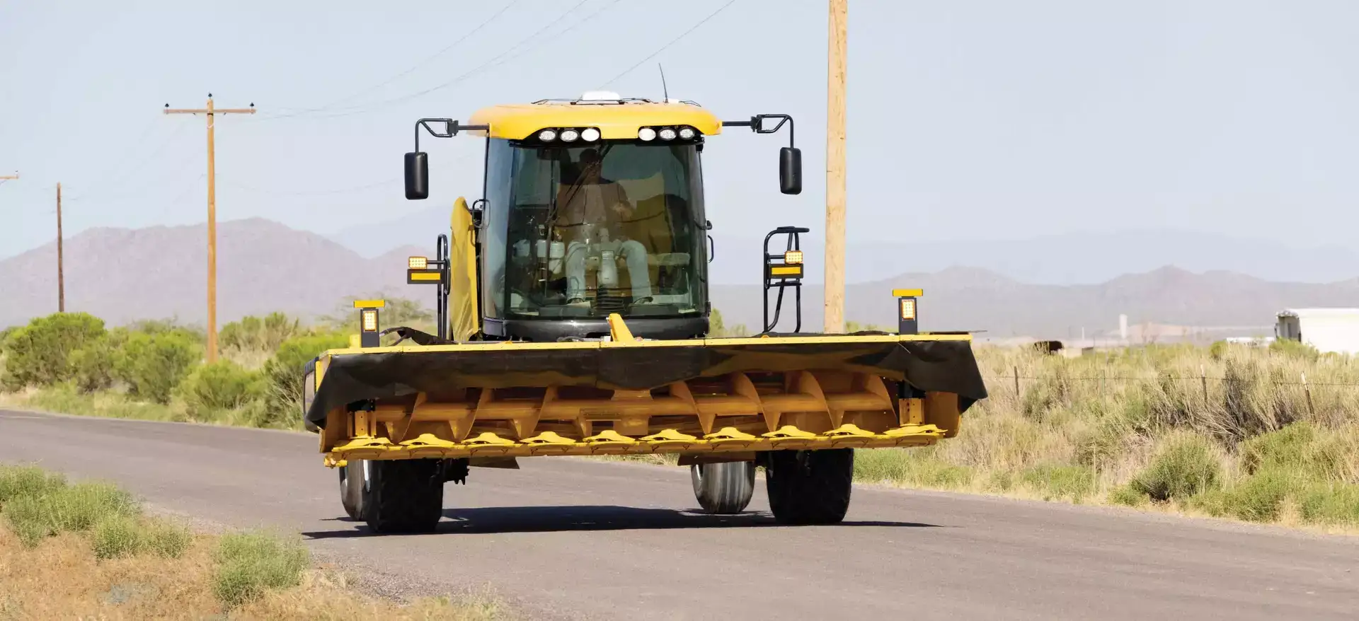 Speedrower® PLUS Self-Propelled Windrower on the road