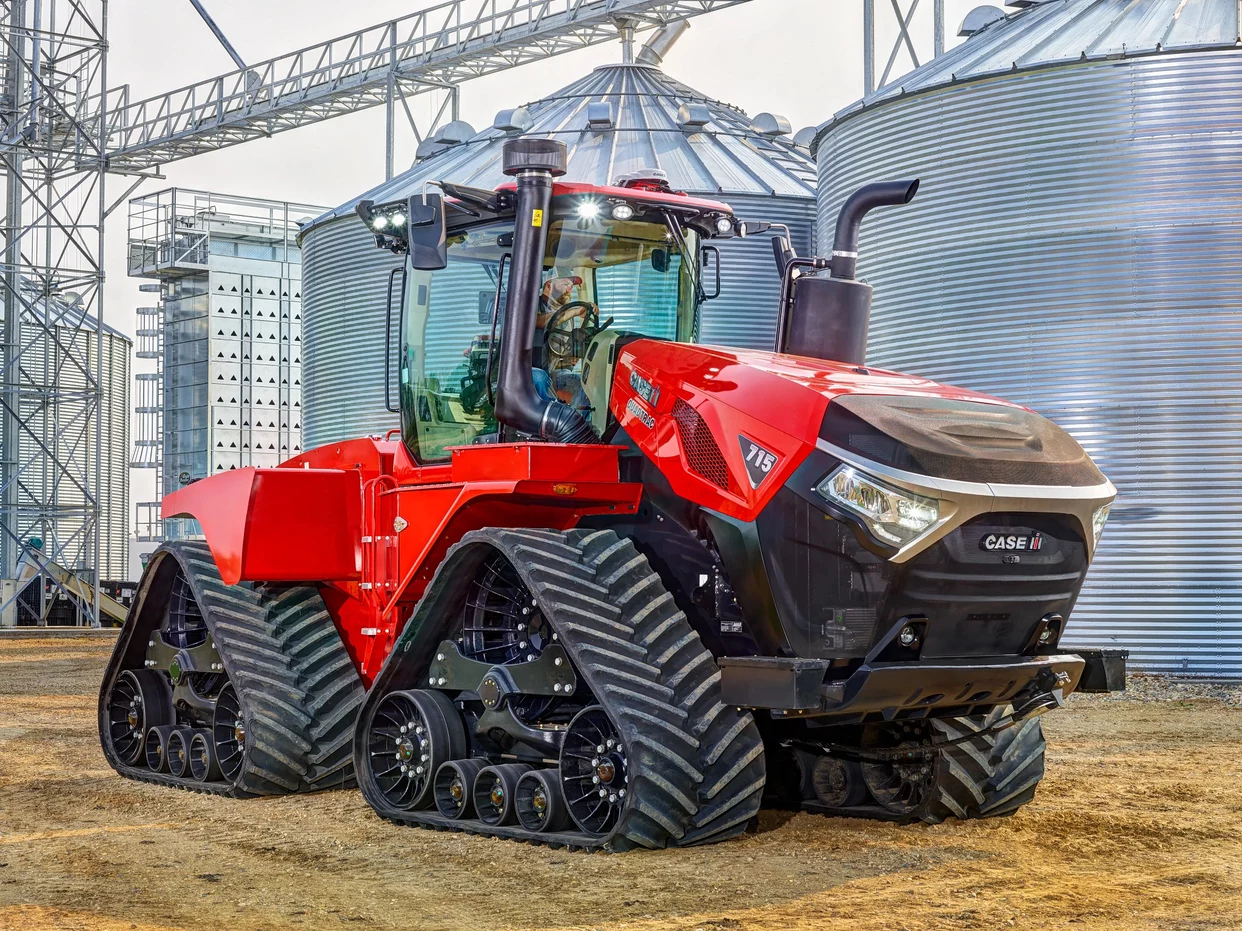 Steiger 715 in front of grain elevator