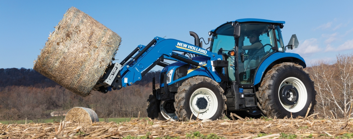 PowerStar tractor lifts a bale