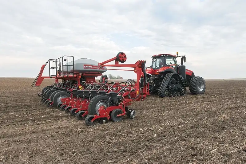 Magnum Rowtrac pulling Early Riser 2000 series planter