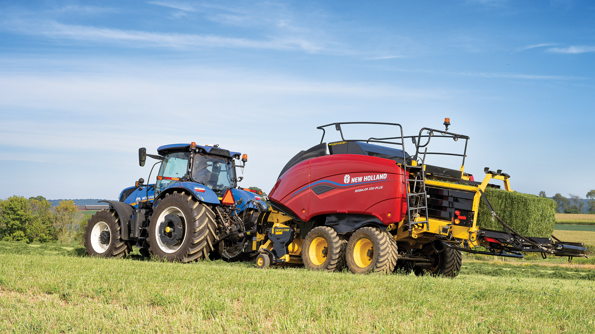 Tractopelle New Holland avec excavatrice et remorque basculante Maxi