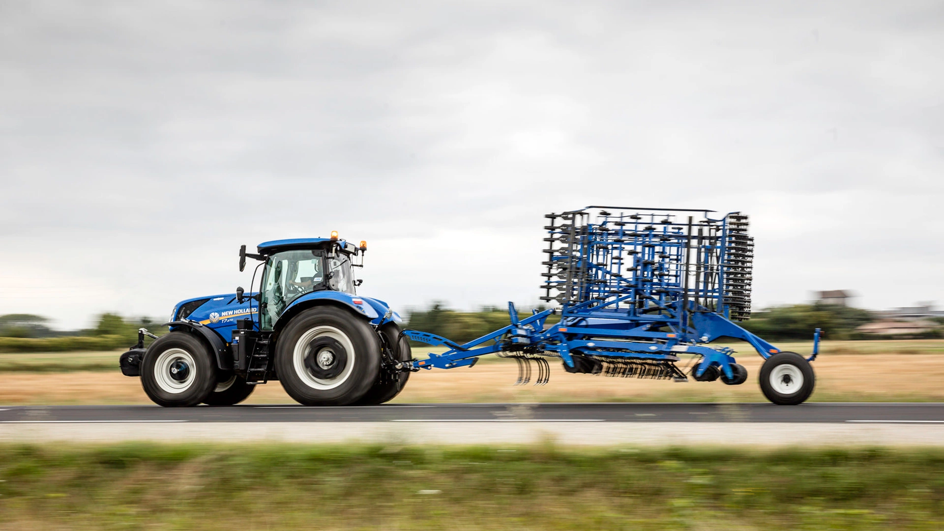 T7 LWB Farming Tractor transporting tillage equipments