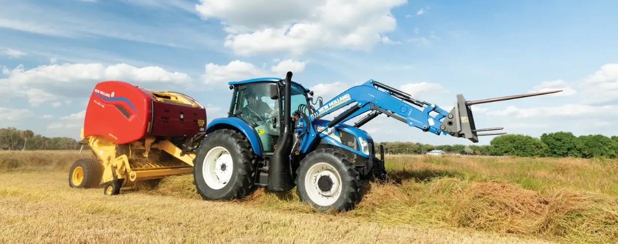 PowerStar tractor pulls a baler