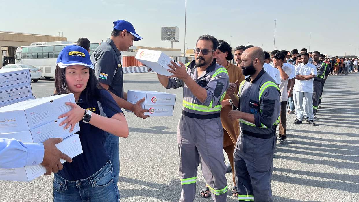 New Holland Middle East and Africa team distributes 500 meal packs to people in labor camps