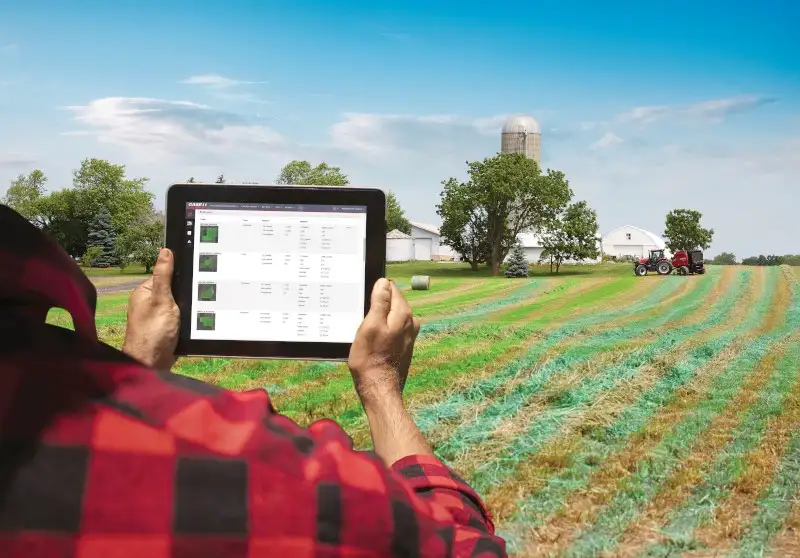  Man in holding up ipad with AFS Connect in field