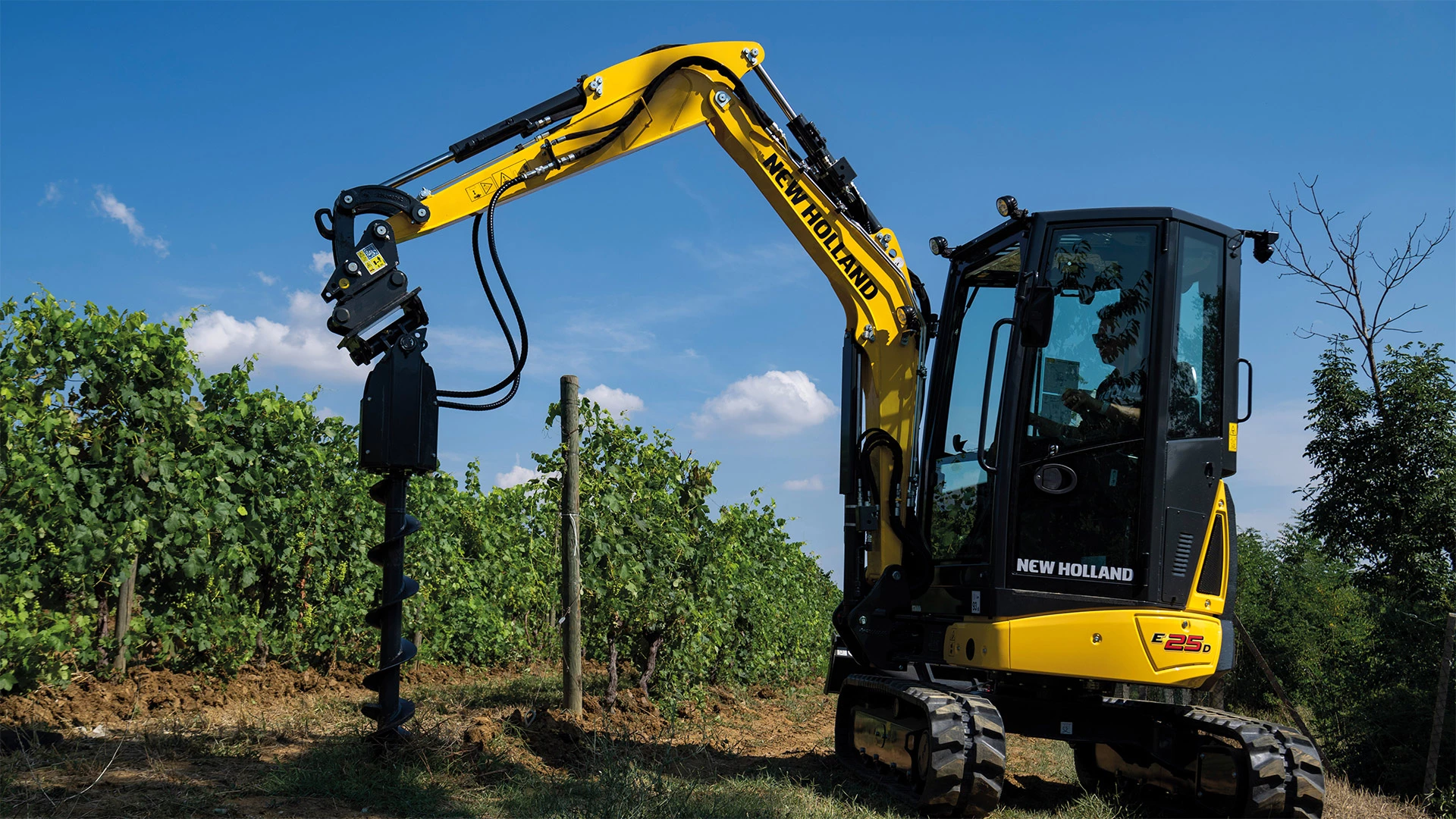 D-Series Mini Excavator working with an auger