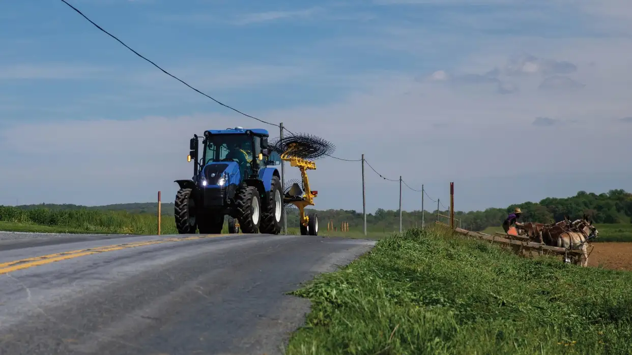 WorkMaster tractor driving in a road.