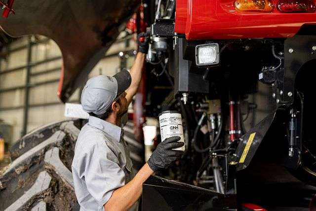 technician installing oil filter