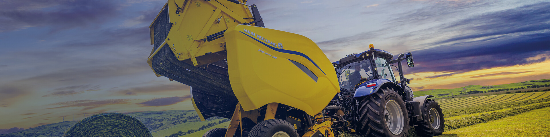 New Holland Pro-Belt baler working in field with sky backdrop