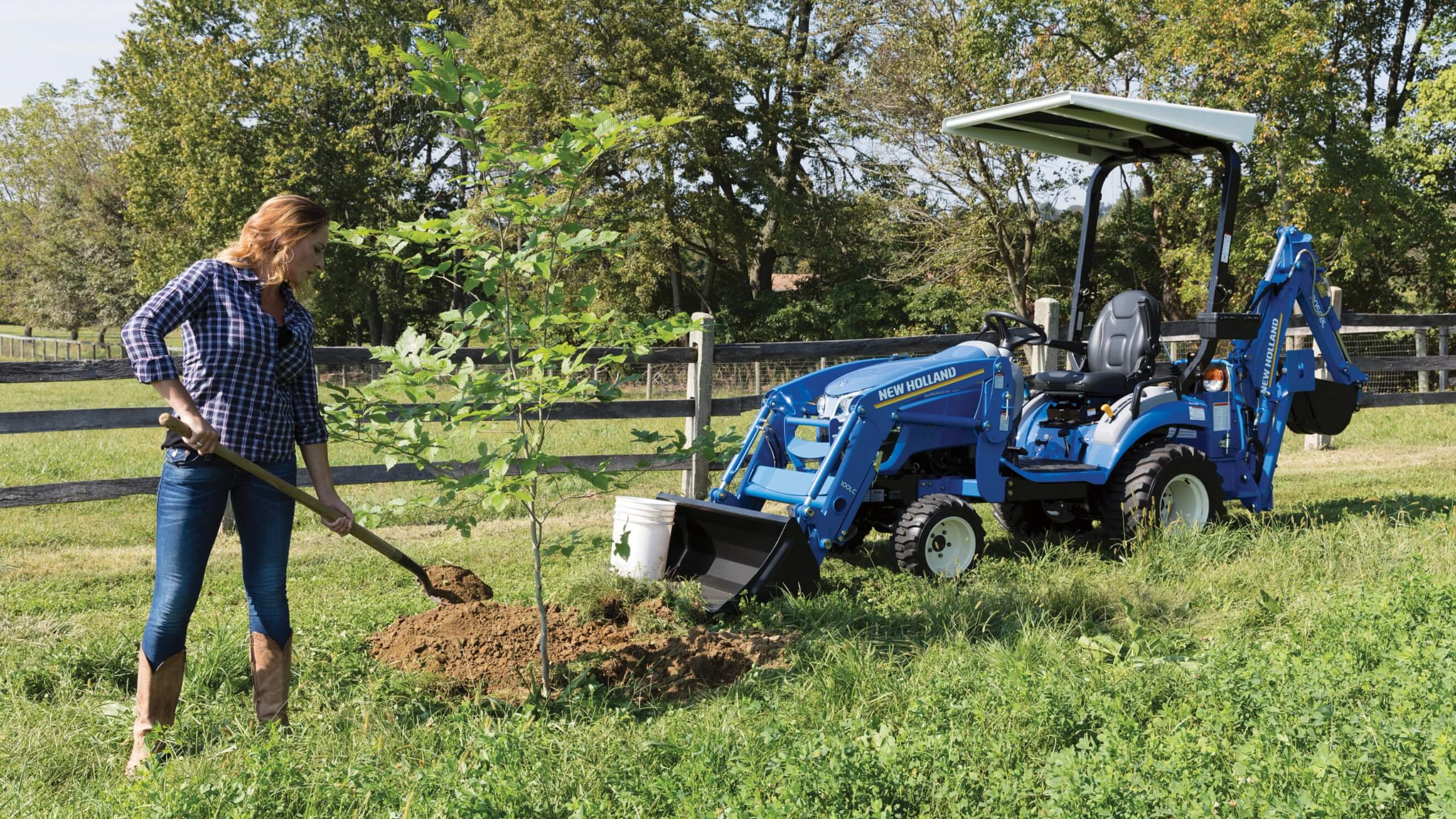 Lawn tractor with online backhoe