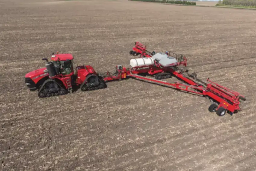 A tractor with tracks in a field