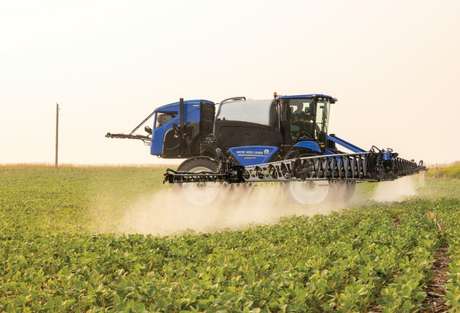 New Holland Sprayer in field.