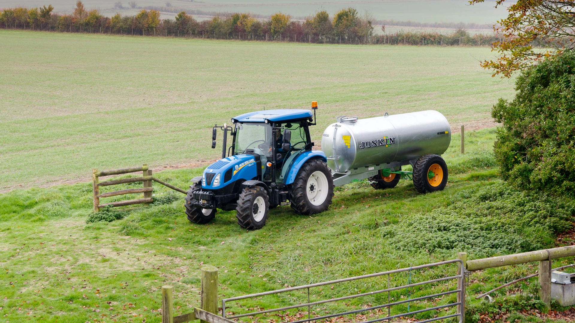New Holland T4S tractor on duty transporting agricultural supplies