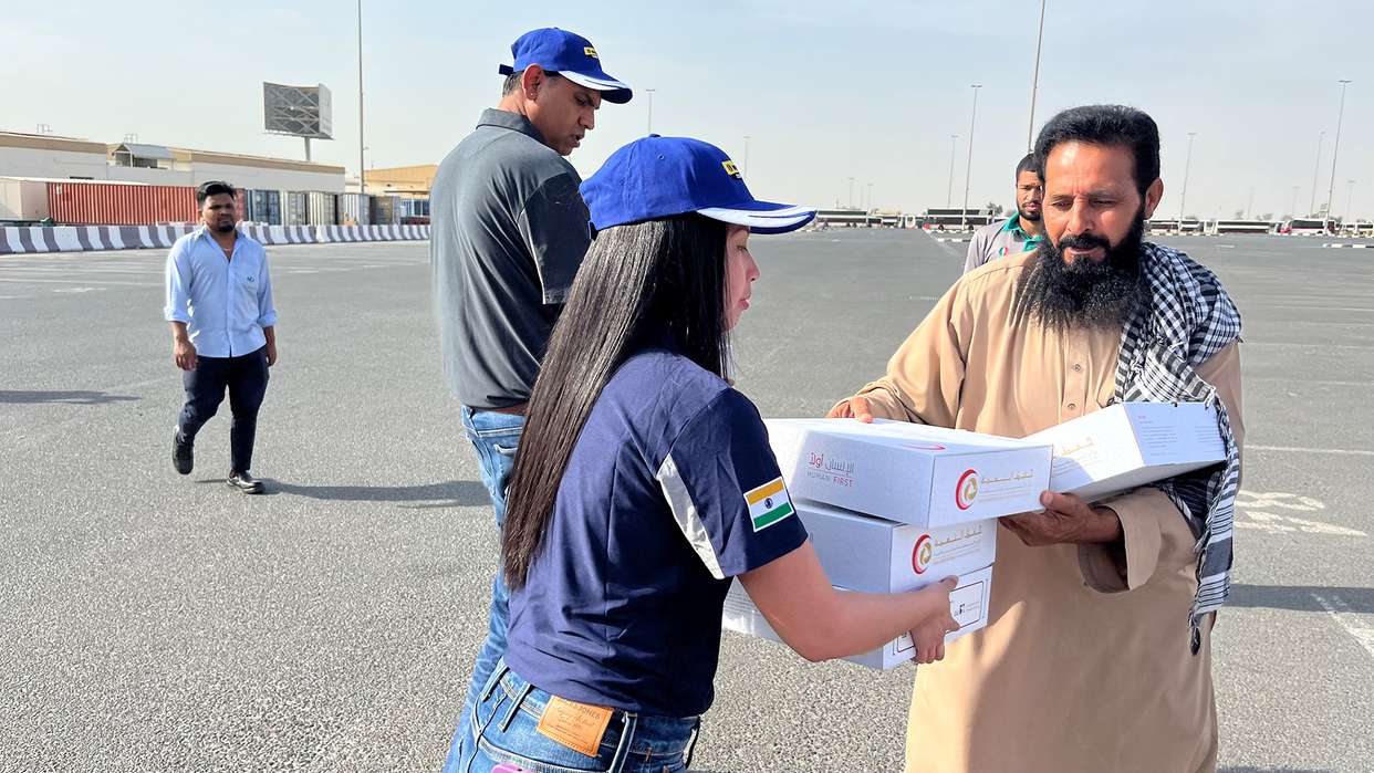 New Holland Middle East and Africa team distributes 500 meal packs to people in labor camps