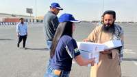 New Holland Middle East and Africa team distributes 500 meal packs to people in labor camps