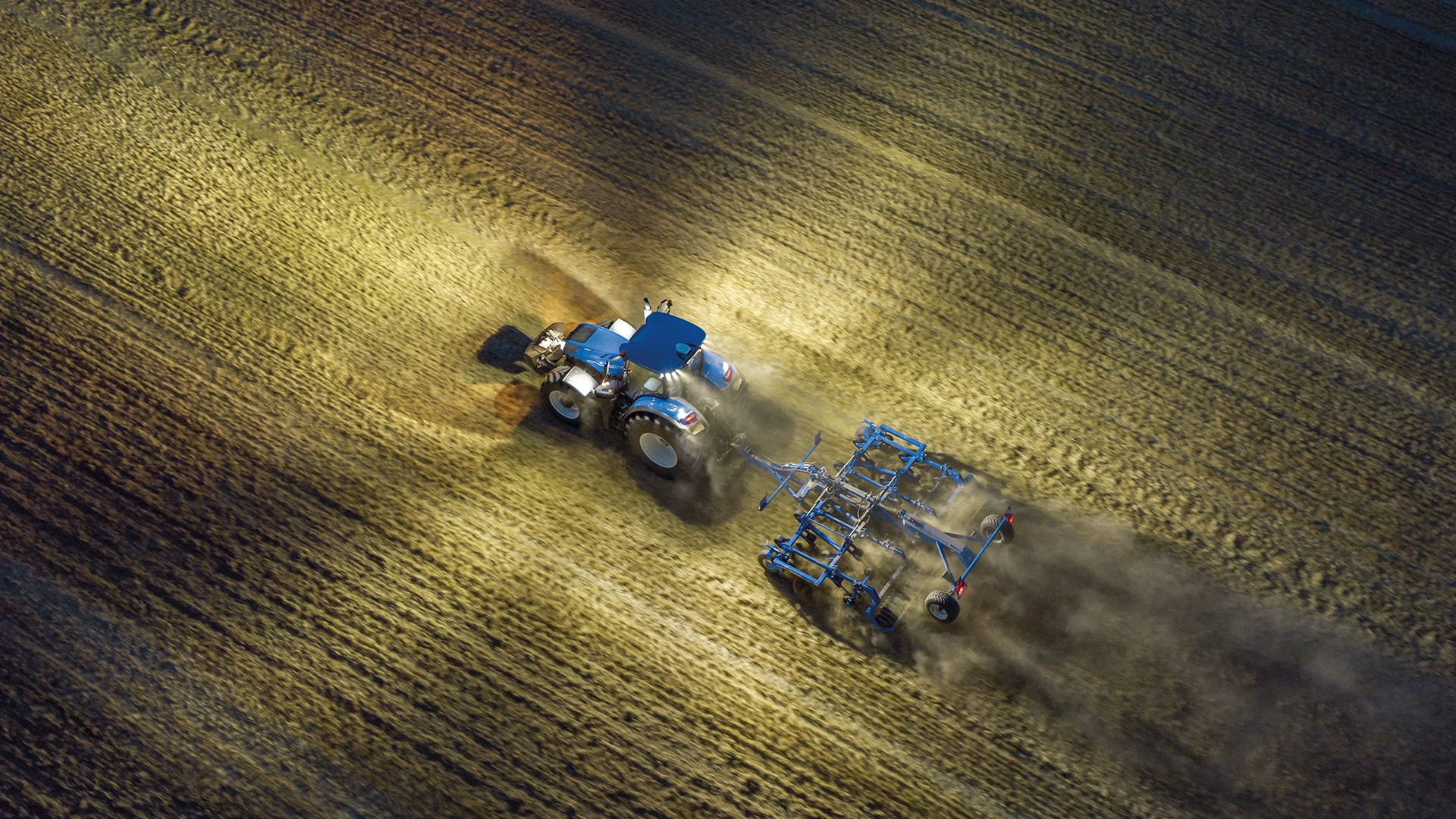 T7 Heavy Duty With PLM Intelligence Tractor working during the night