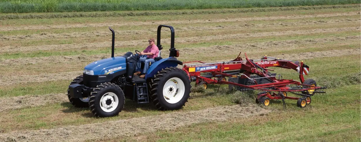 Tractor with a ProRotor™ rotary rake attachment