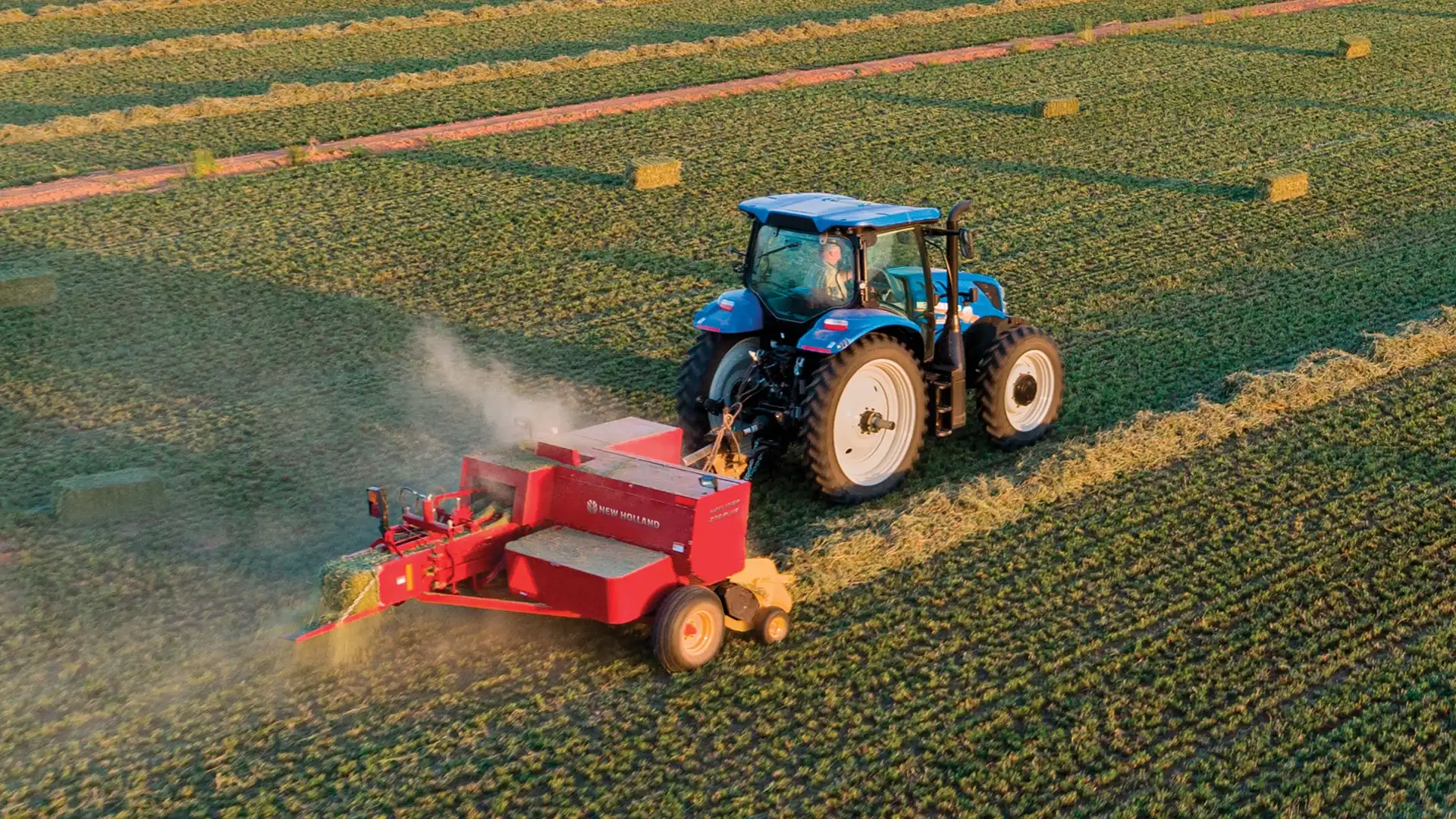 Tractor pullls a Hayliner® Small Square Baler