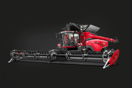 Red Case IH combine harvester with a wide grain header attached, shown in side profile against a black studio background.