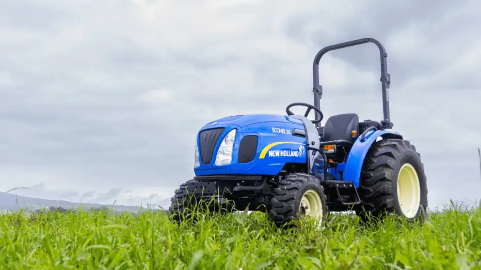 New Holland Boomer tractor sitting in field