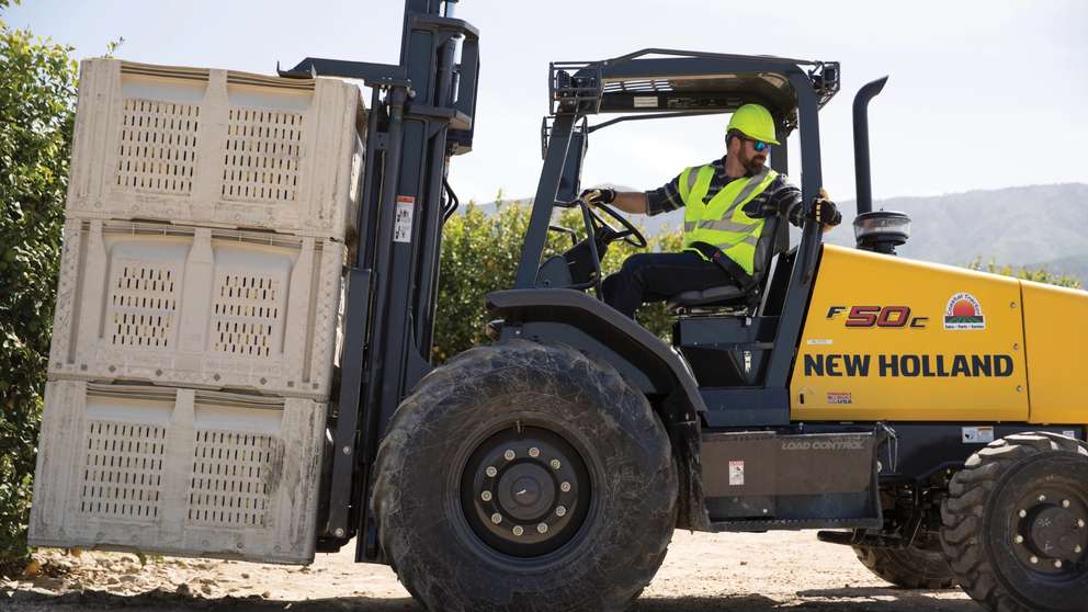 Forklift lifting up crates.