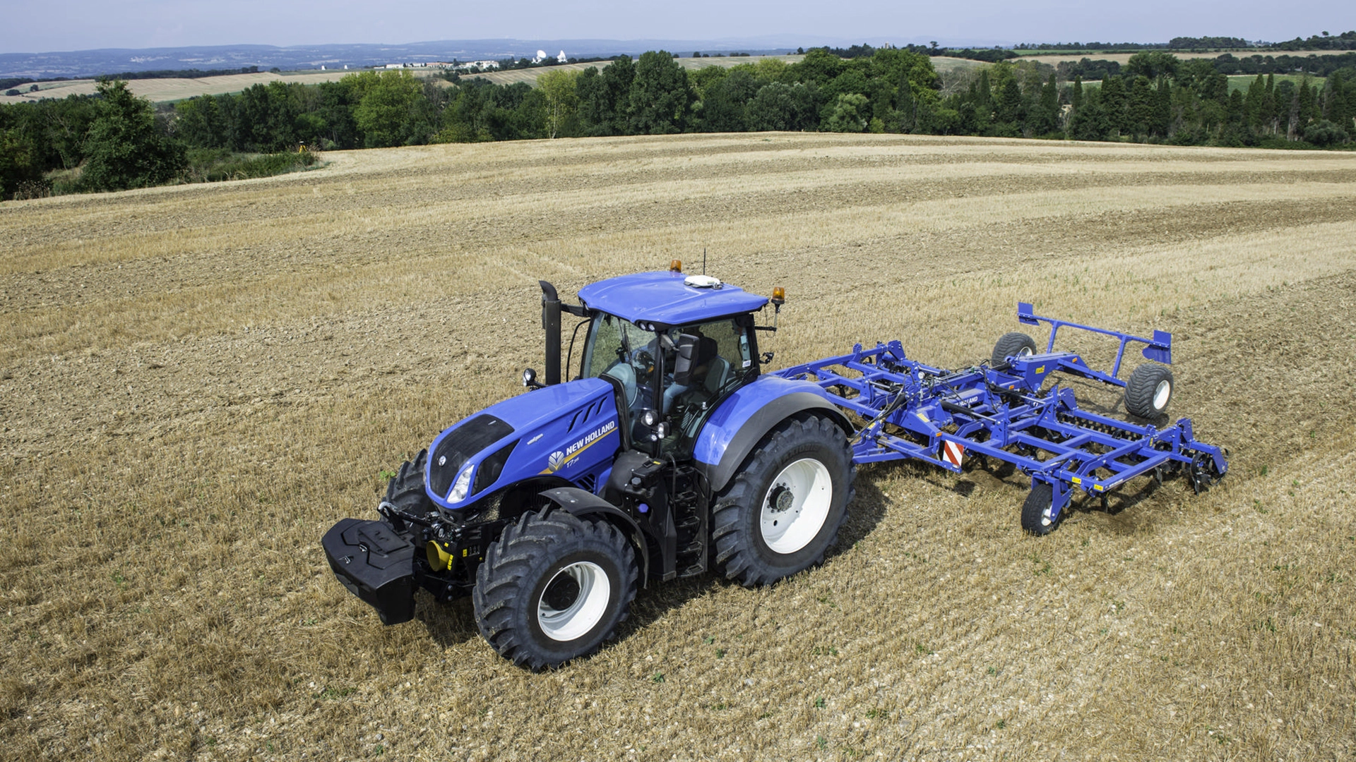 On-field operation of tractor-mounted stubble cultivator with rigid tine cultivator and rear rollers