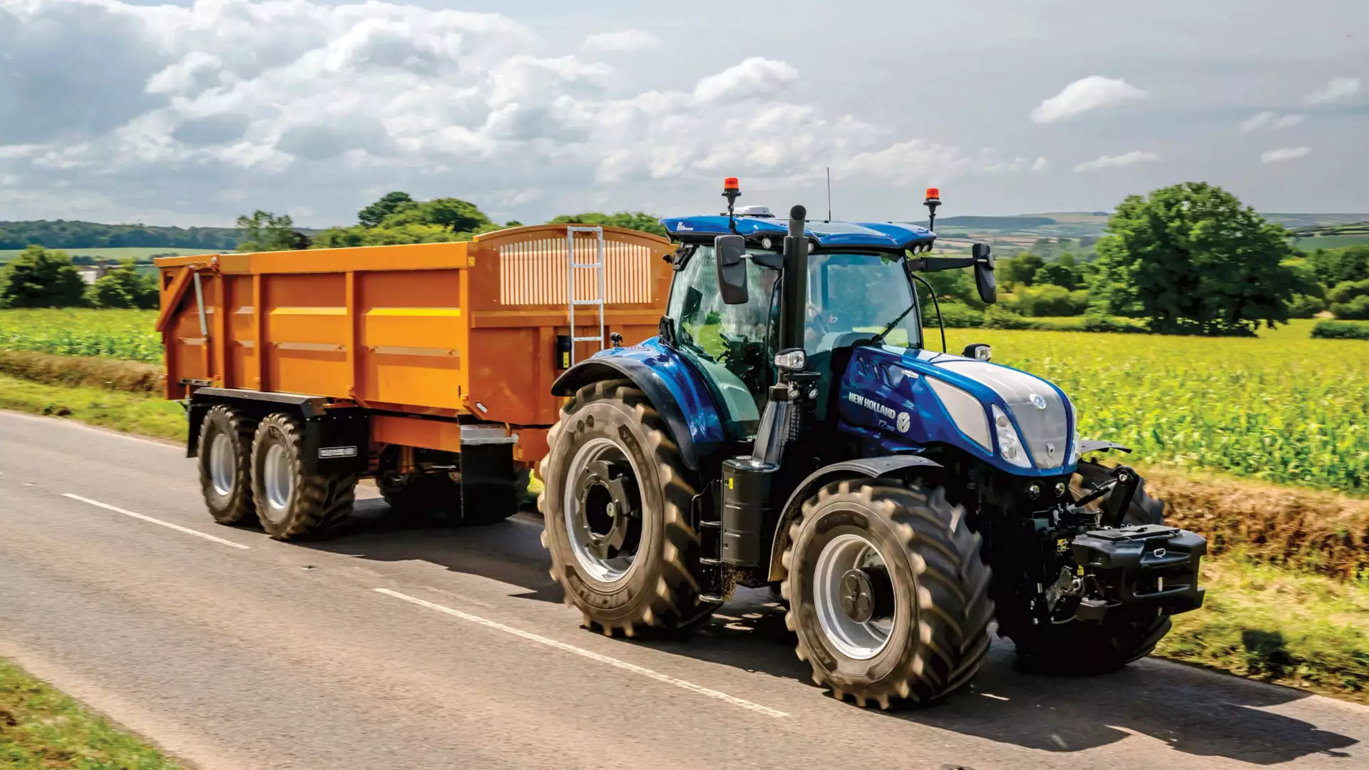 T7 Series tractor pulling a trailer