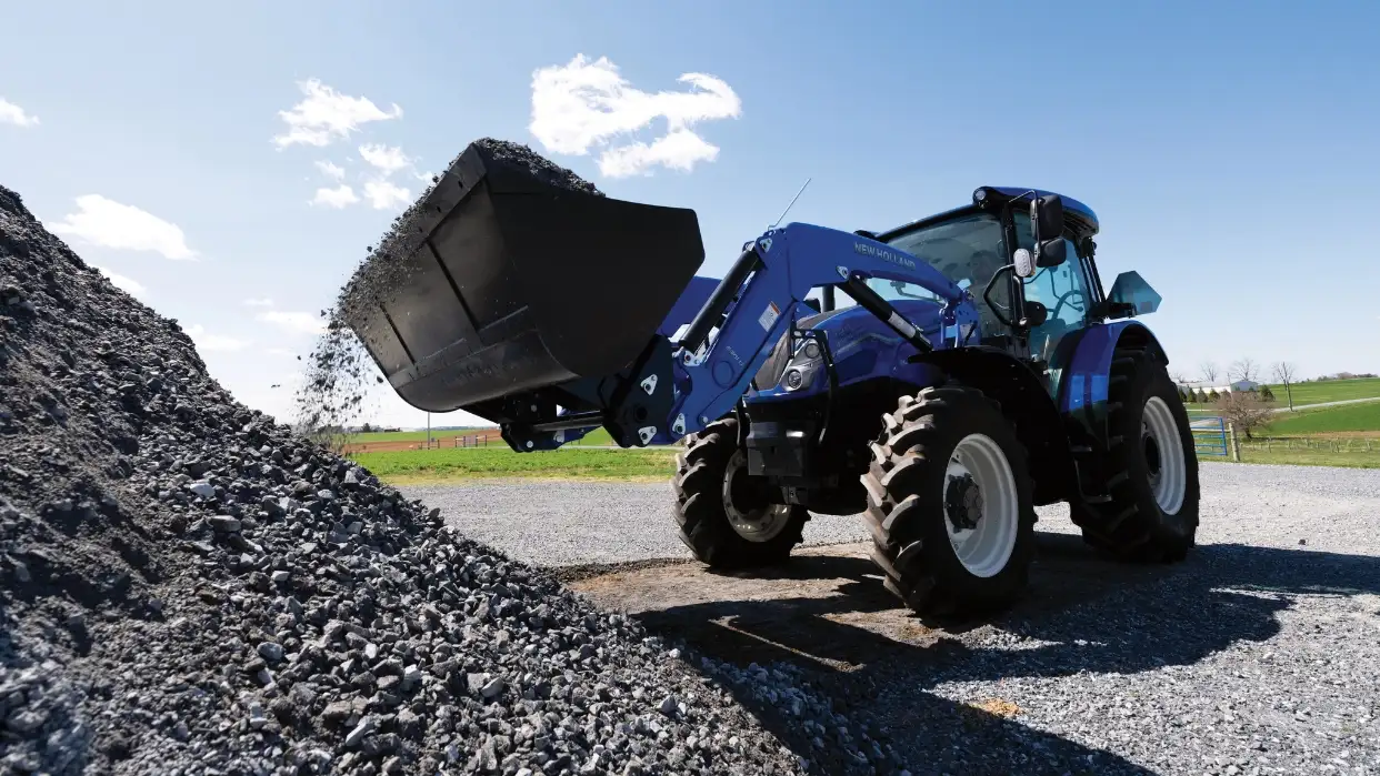 WorkMaster tractor moving rocks.