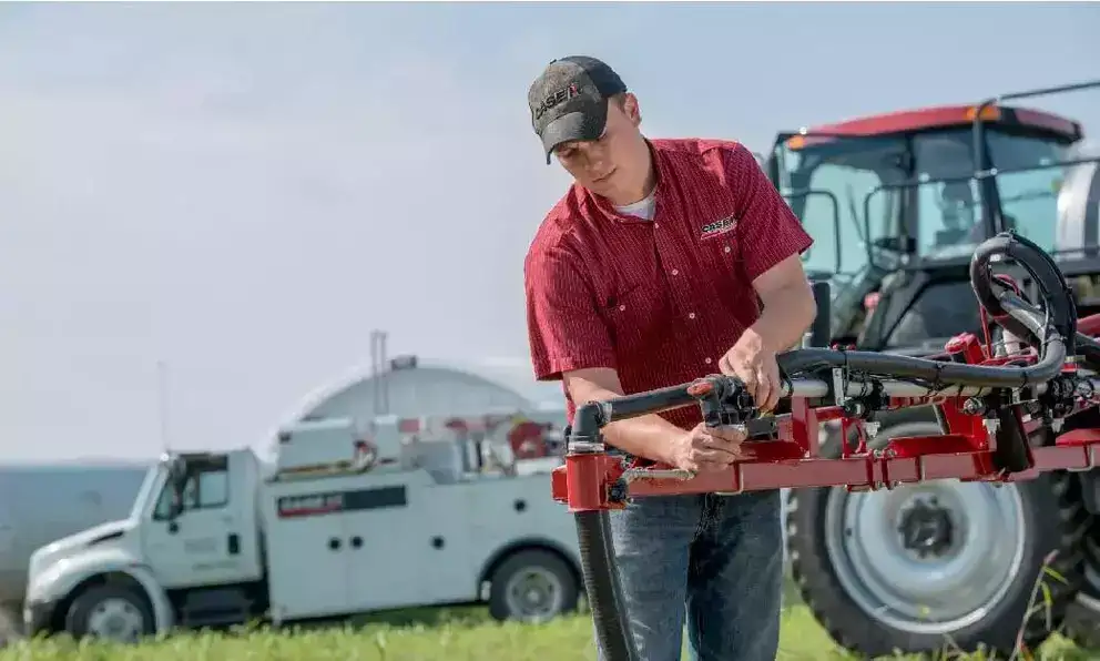 Technician adjusting sprayer