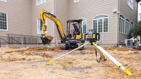 Mini excavator in backyard.