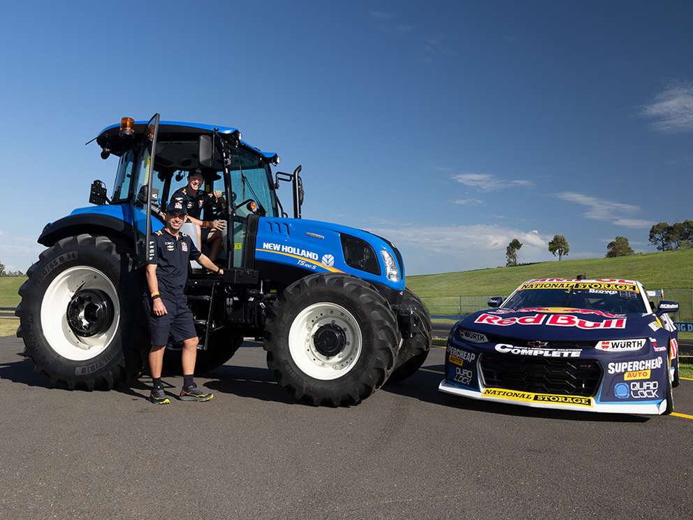New Holland T7 tractor with Redbull V8 Supercar on track at Sydney Motorsport Park