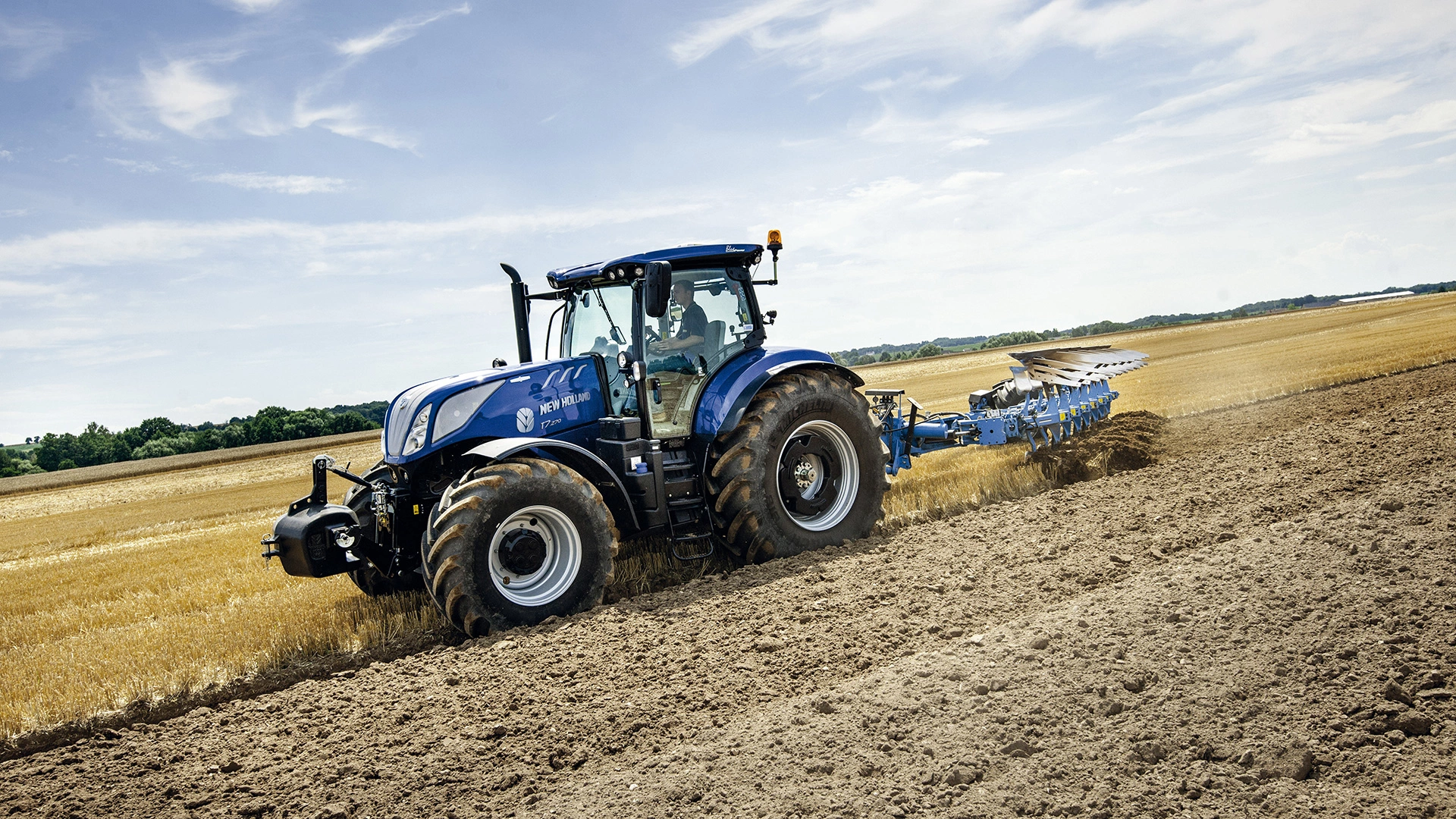 T7 SWB Tractor working on the field