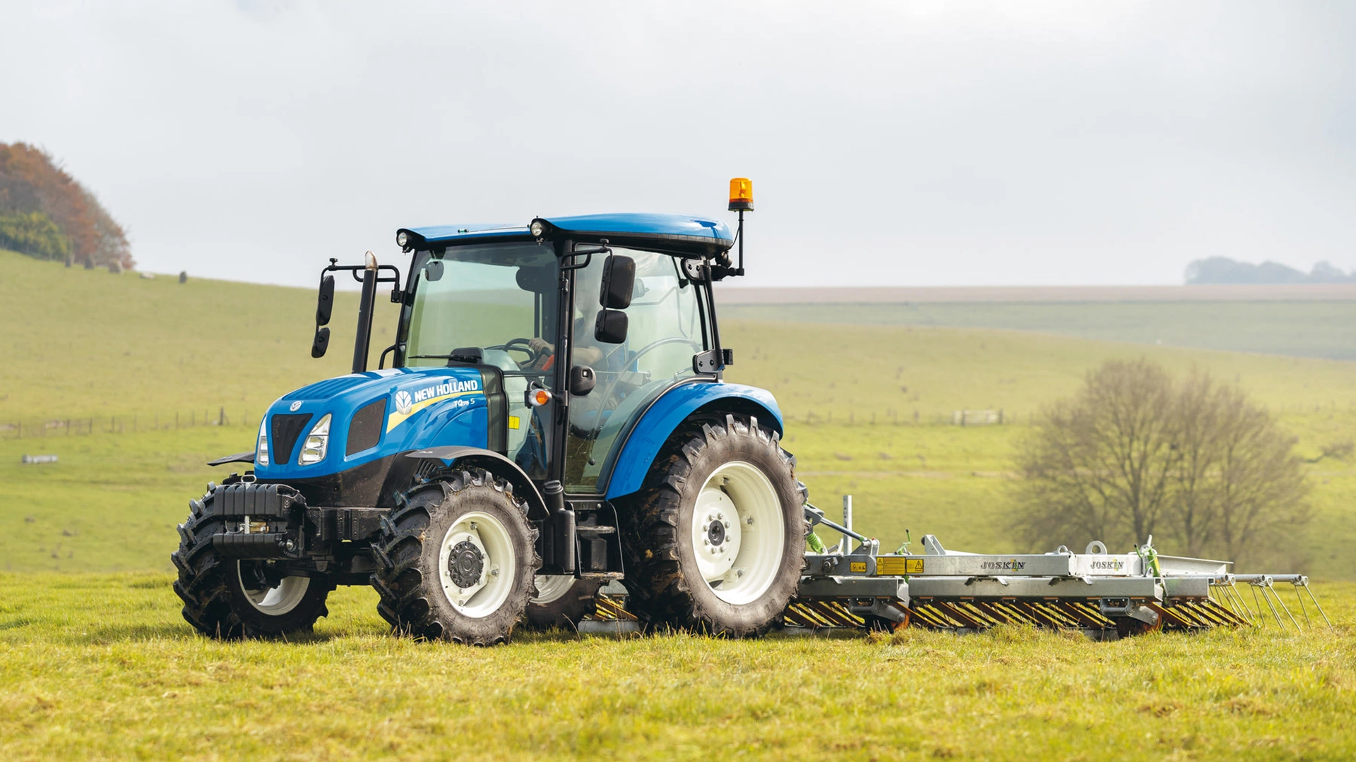 New Holland T4S agricultural tractor diligently working on the field