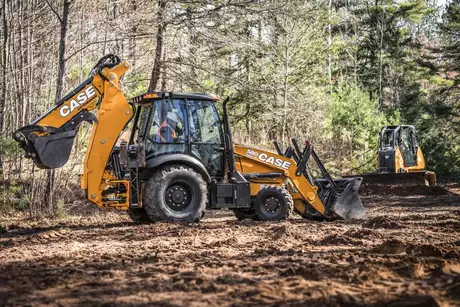 580 Super N Construction King™ Backhoe Loader action shot